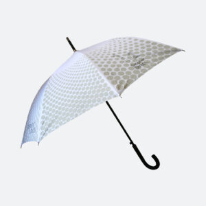 Side view of grey and white dotty pattern umbrella