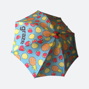 Light blue umbrella with fruit pattern across the 8 panels