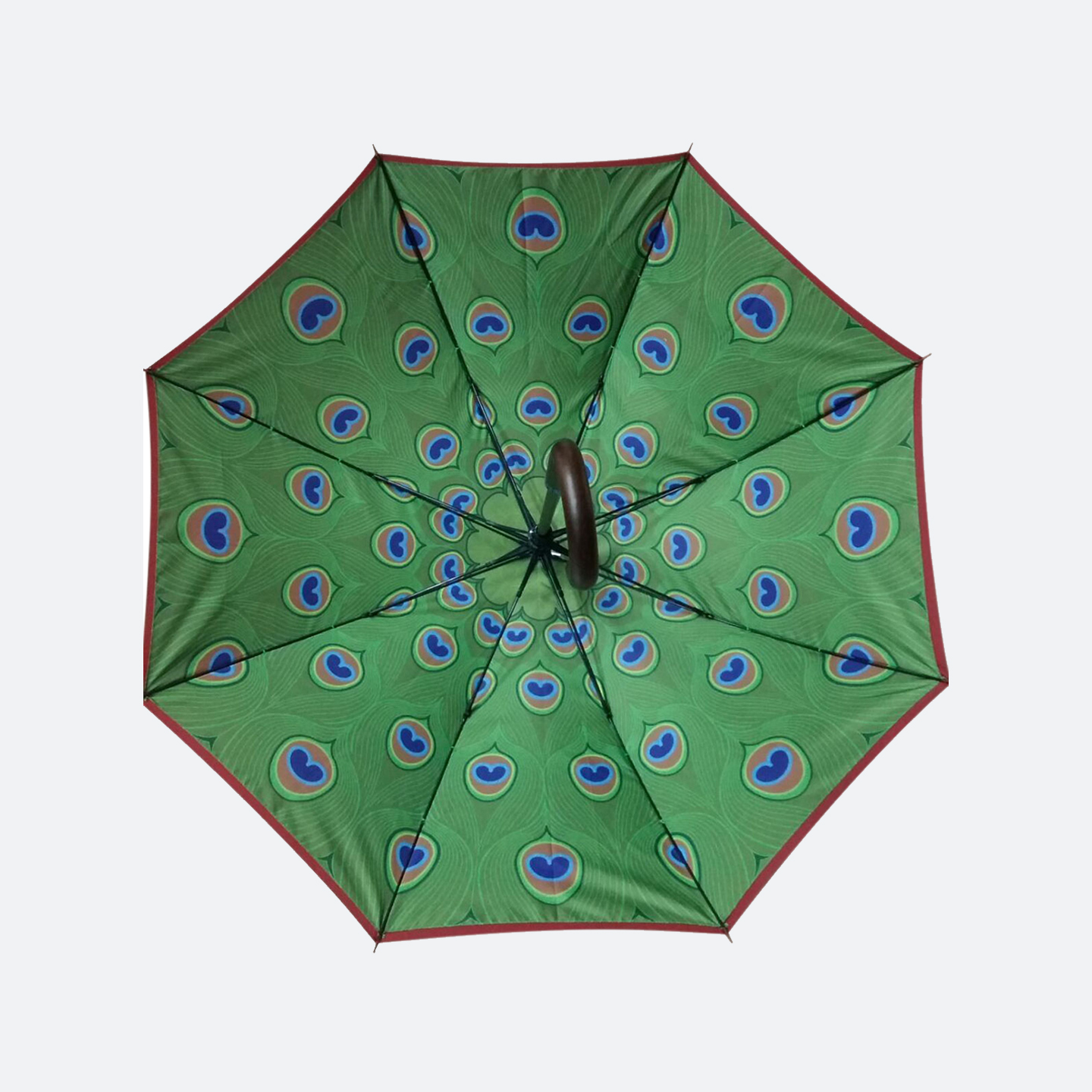 Inner umbrella view of a green peacock feather pattern