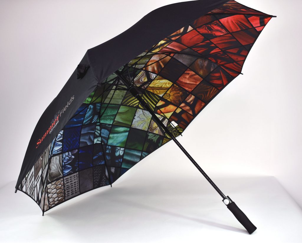 Vivid stained glass window print on inside of umbrella