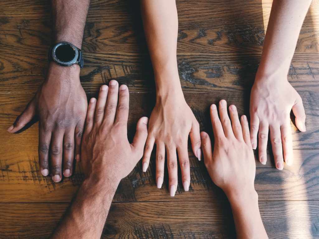 hands on a desk