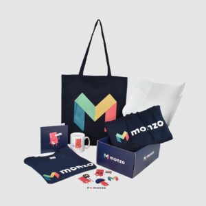 employee engagement ideas employee onboarding box of branded merchandise from Monzo
