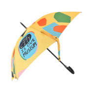 printed umbrella with outside prints, patterns and writing on one panel that says THE CITY is our museum side view