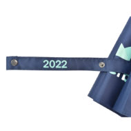 tie wrap for umbrella is navy blue with turquoise numbers 2022 printed with popper for closure