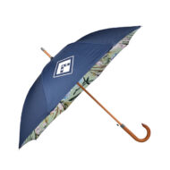 luxury branded umbrella shown on the side with blue external panels and print on the inside. Wooden pole and handle