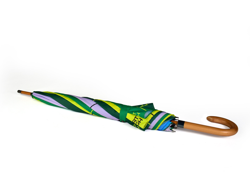 printed recycled closed or tied umbrella different colours with a curved wooden handle