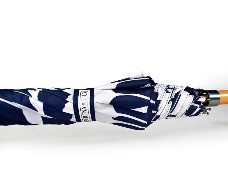 printed umbrella tie wrapped closed, wooden handle