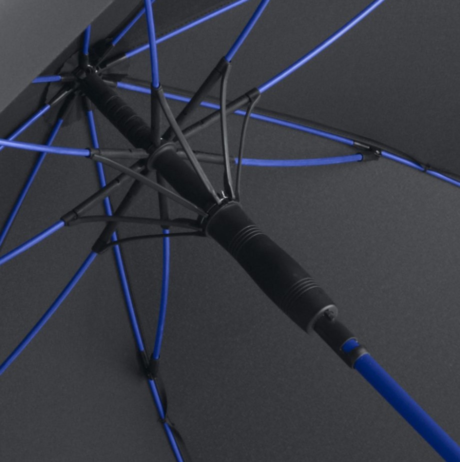 inside of black panel umbrella showing royal blue umbrella frame and pole