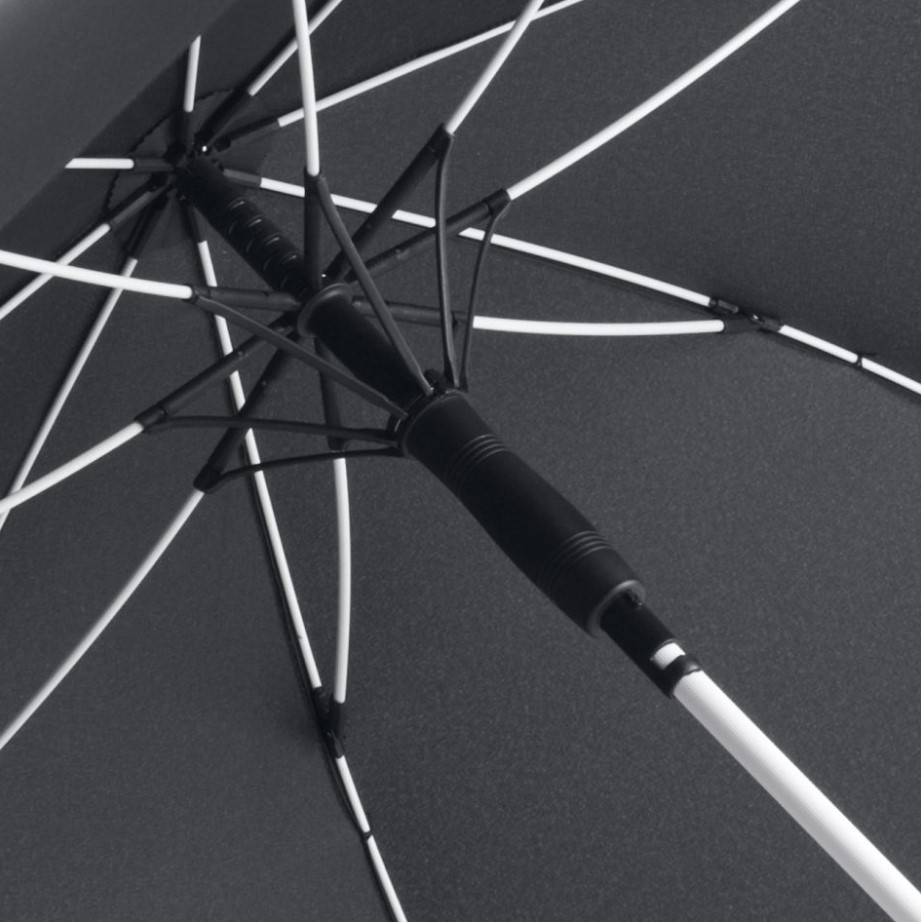 inside of black panel umbrella showing white umbrella frame and pole