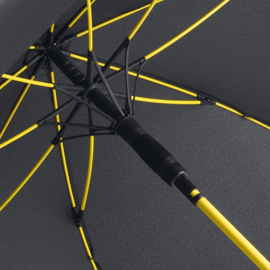 inside of black panel umbrella showing yellow umbrella frame and pole