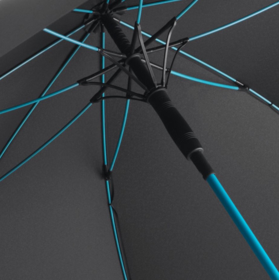 inside of black panel umbrella showing turquoise umbrella frame and pole