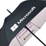 Arrow Microsoft CoPilot Umbrella with black outside panels and bright print on inside
