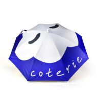 outside panels of umbrella with white cloud and white text logo that says coterie