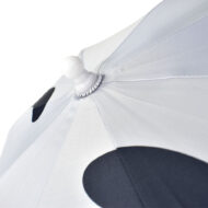 white rounded tip of child size umbrella with white umbrella panels and black print