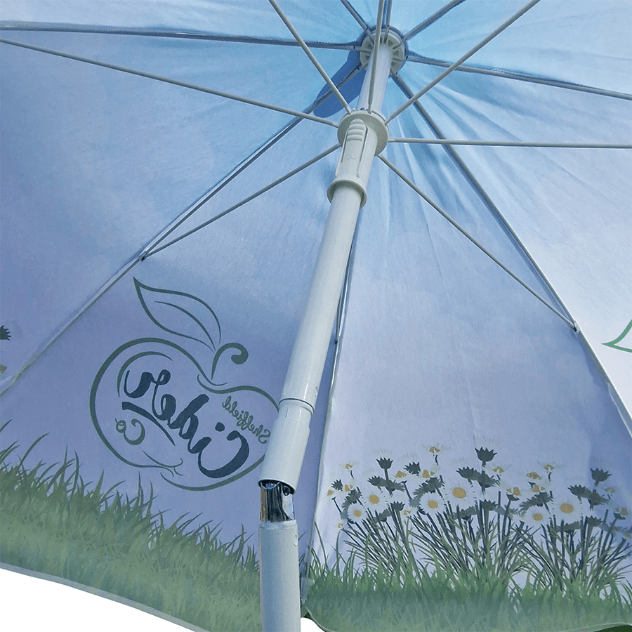 white steel pole shown tilted on traditional garden parasol