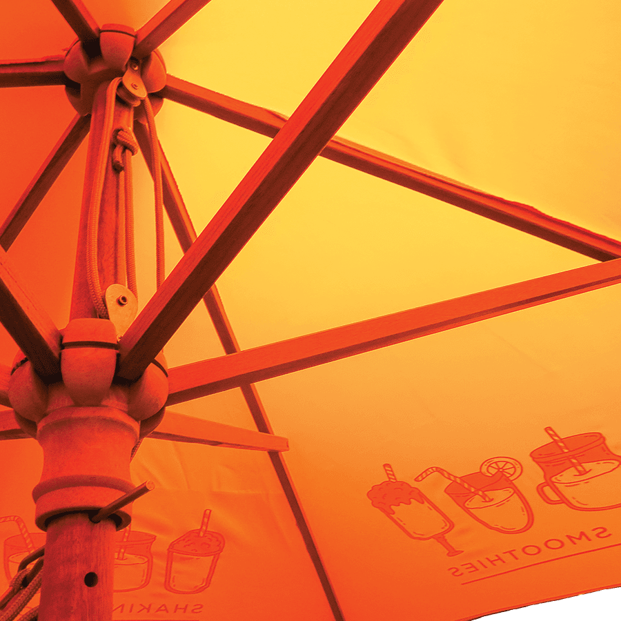 printed parasols UK with yellow panels and wooden ribs
