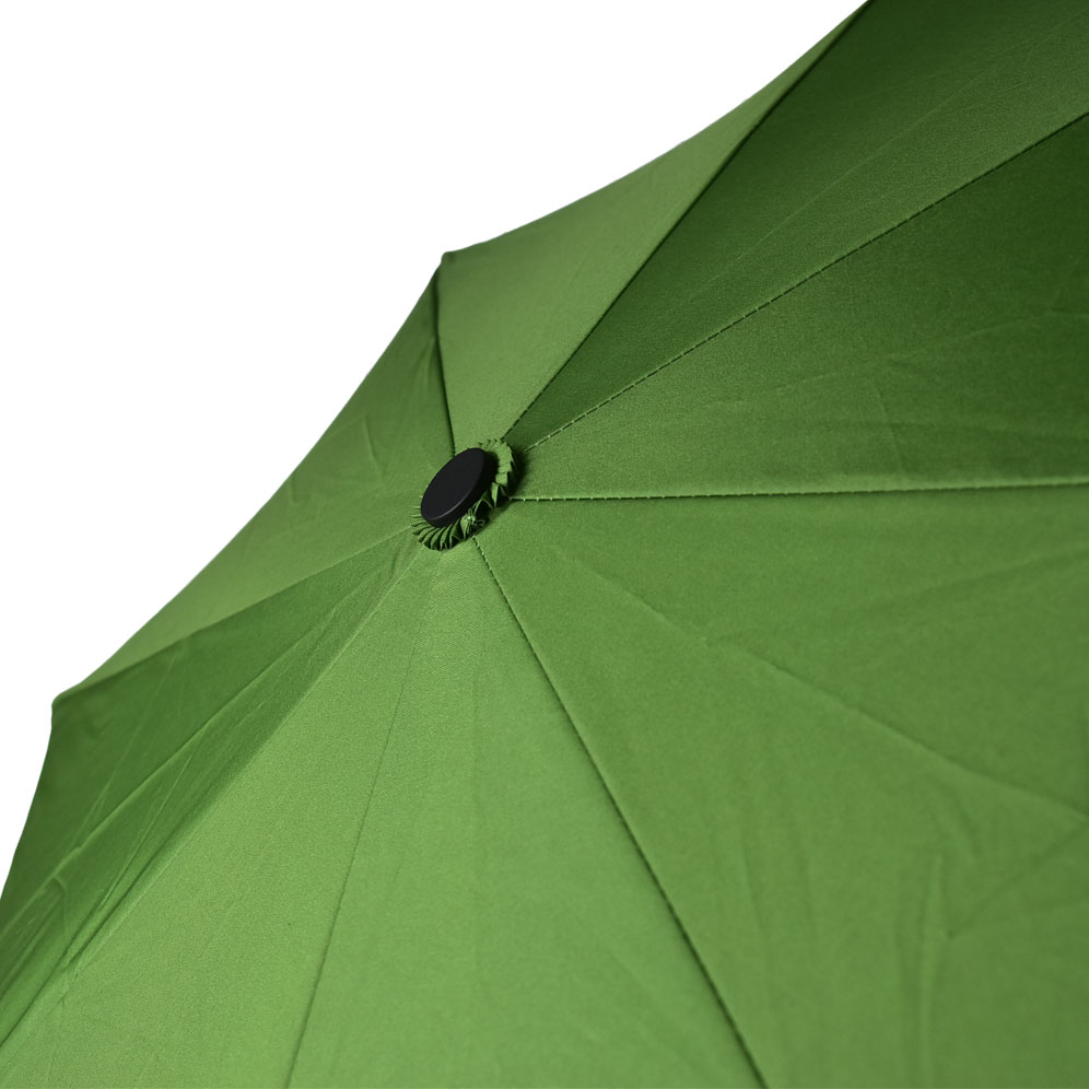 tip of open umbrella with flat tip in black with green panels
