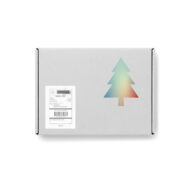 white closed presentation box with black printed Christmas tree on it and a shipping label