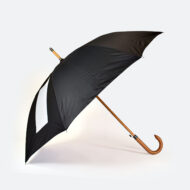 side view of black panels on umbrella with white rectangle for band merch