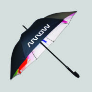 black umbrella with vibrant print on inside of umbrella on grey background