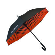 walking umbrella with black external panels and orange inside print with black polka dot
