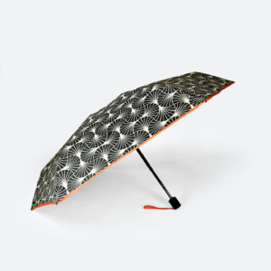 side view of black and white printed compact umbrella with 6 panels for C-suite luxury branded merchandise