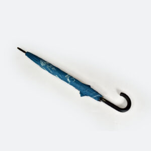 Walking umbrella with black curved handle folded neatly with tie wrap