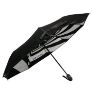 side view of umbrella with black outside panels and silver and black on the inside