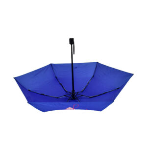 upside down open umbrella with blue canopy and folding black pole and handle