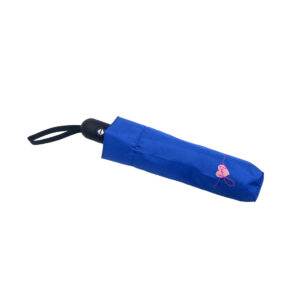 small compact blue umbrella in printed carry case