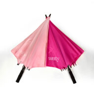 two large premium branded golf umbrellas semi open crossed over each other in baby pink and hot pink