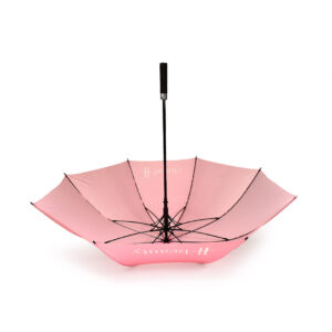 upside down open view of large golf umbrella with baby pink panels