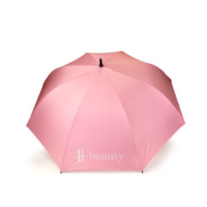 open view of pastel pink Harrods golf umbrella with white logo print