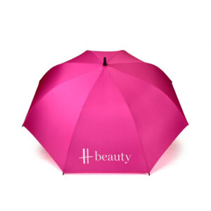open view of hot pink Harrods golf umbrella with white logo print